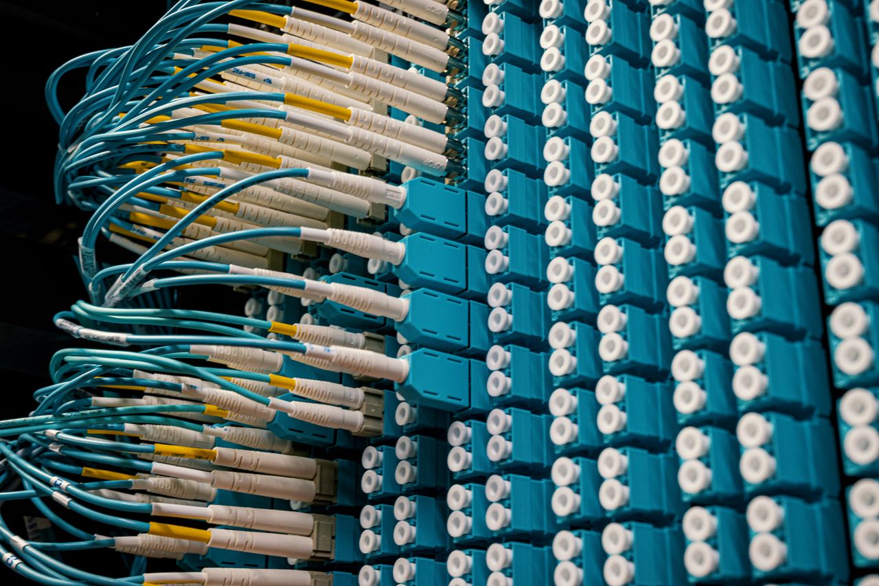 gallery-4 From below of fiber optic equipment with similar colorful rubber cables and round sockets